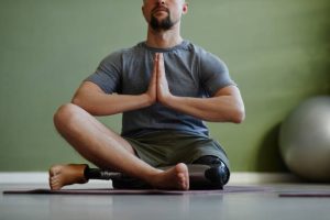 disabled man doing yoga pose